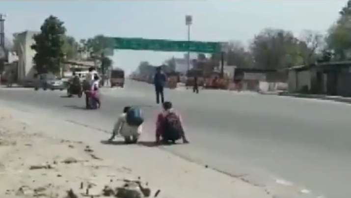 Police make lockdown violators crawl with their bags in