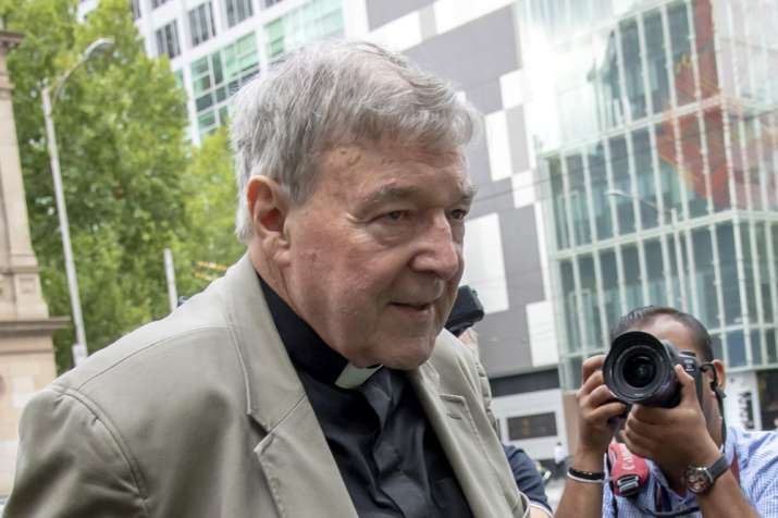 In this Feb. 26, 2019, photo, Cardinal George Pell leaves the County Court in Melbourne, Australia.