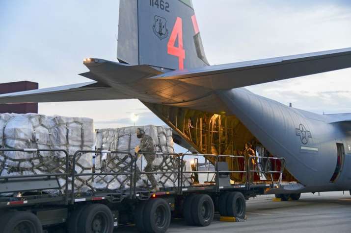 In this Tuesday, April 7, 2020 photo provided by the U.S. Air National Guard, airmen from the 146th