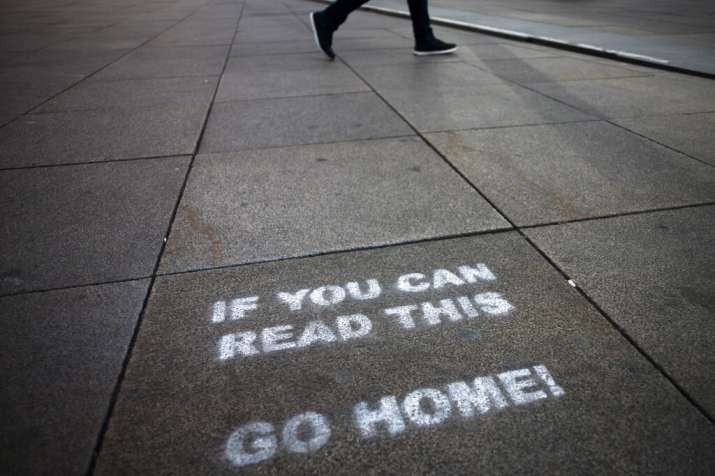 A message demanding the people to go home is sprayed on the ground of Alexanderplatz square in Berli