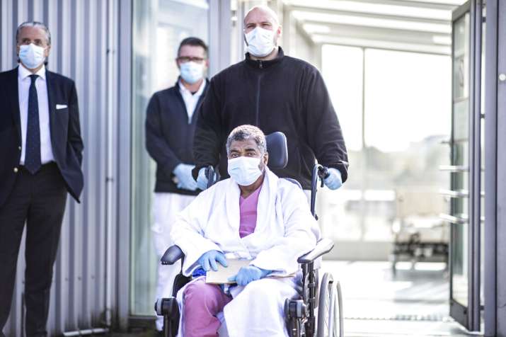 The recovered 68-year-old corona patient Mohammed S. from France sits in a wheelchair as he leaves t