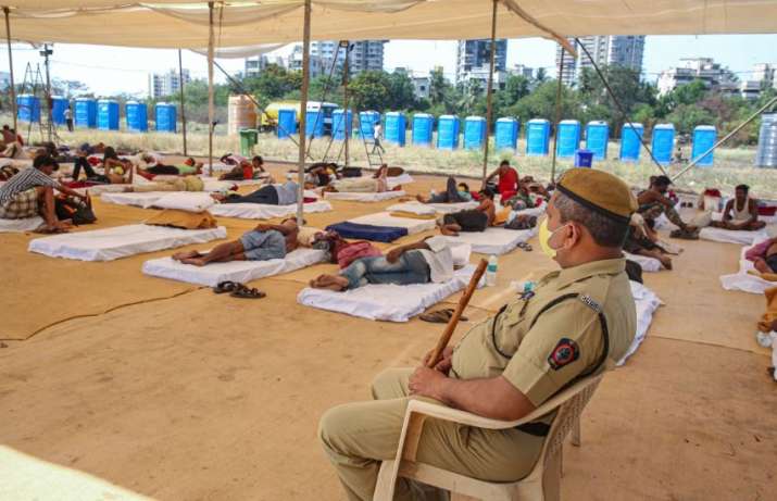 India Tv - Stranded people take rest inside a relief camp set up during the nationwide lockdown, in wake of cor