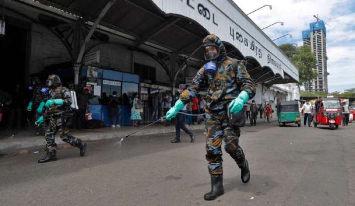Sri Lankan government soldiers in protective clothes spray