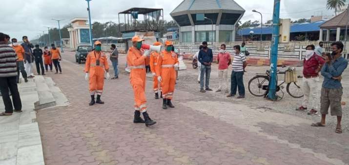 This image shows NDRF personal making announcements to warn