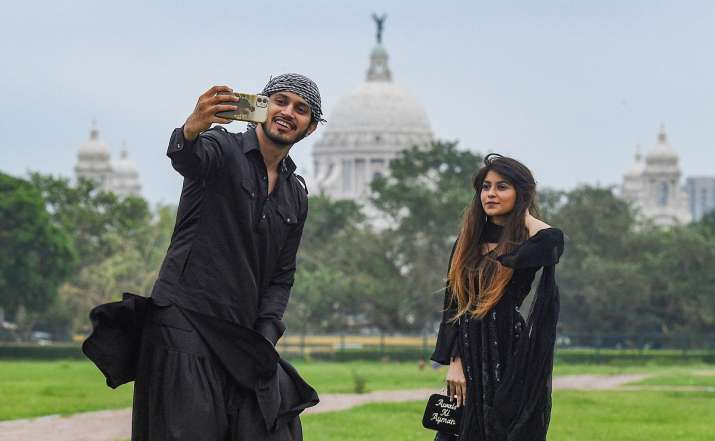 India Tv - Kolkata: Youth click photographs while celebrating Eid-ul-Fitr at a park, during the ongoing COVID-19 lockdown, in Kolkata, Monday, May 25, 2020.