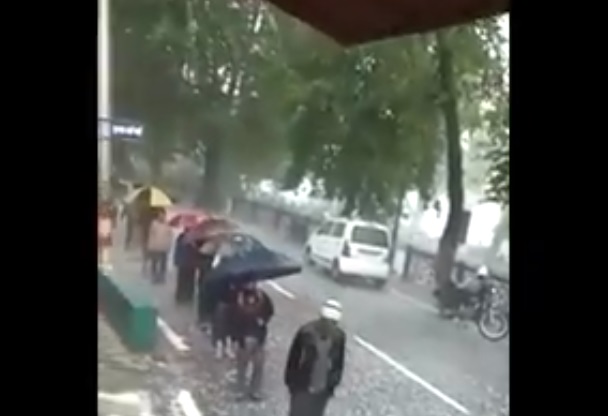 People buy liquor amid heavy hailstorm at Nainital's Mall
