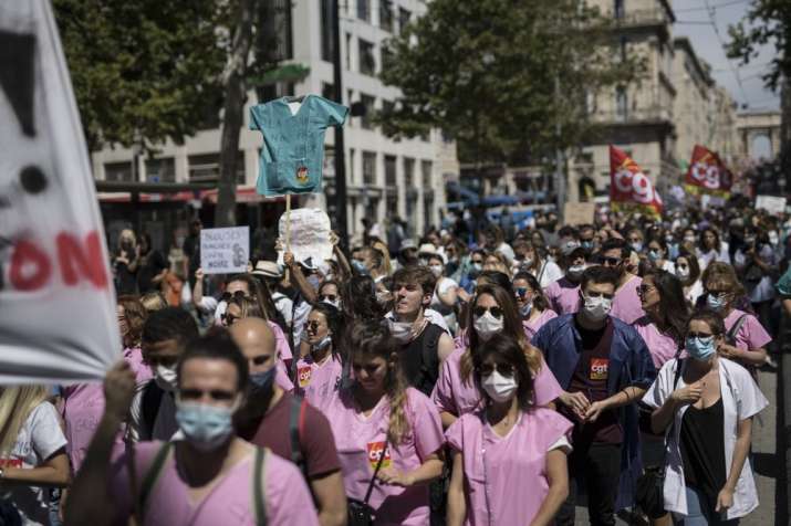 Medical workers march during a demonstration in Marseille, southern France, Tuesday, June 16, 2020. 