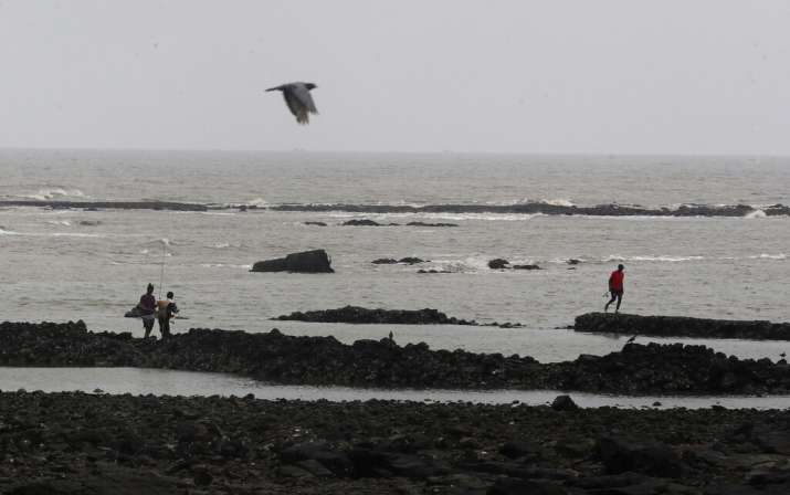 Fishermen arrive to catch fish on the Arabian Sea coast in Mumbai, India, Tuesday, June 2, 2020. Cyc