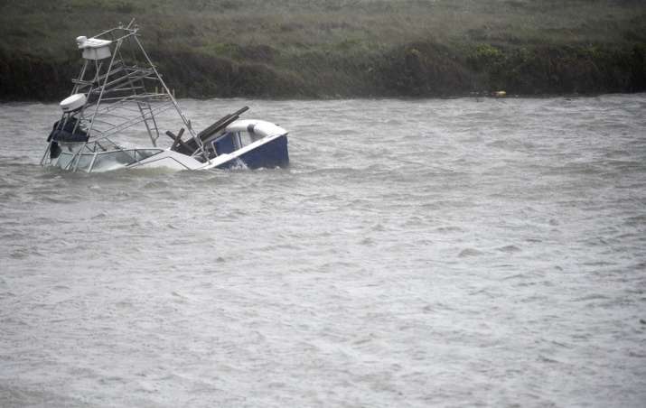 A boat sinks in the Packery Channel during Hurricane Hanna, Saturday, July 25, 2020, in North Padre