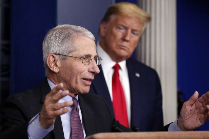 n this April 22, 2020 file photo, President Donald Trump watches as Dr. Anthony Fauci, director of t