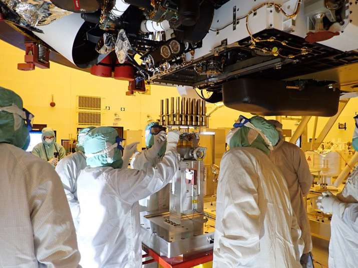 India Tv - In this May 20, 2020 photo made available by NASA/JPL-Caltech, engineers and technicians insert samp