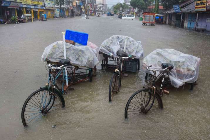 India Tv - Agartala: Tricycle carts parked on a waterlogged road during heavy rain, in Agartala, Tuesday, July 21, 2020.