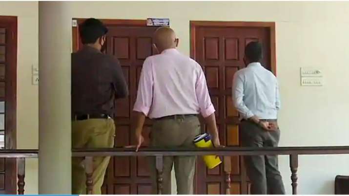 A three-member team of Customs officials at the residence of M Sivasankar to serve him a notice to a