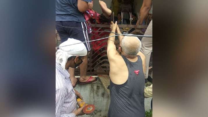 Delhi: Police rescue man who fell from building and got