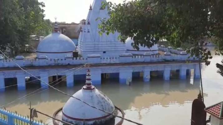 India Tv - The historic Madaneswar Dham Shiv Temple has submerged underwater
