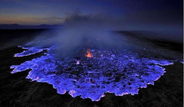 Volcano in Indonesia erupts with electric blue lava