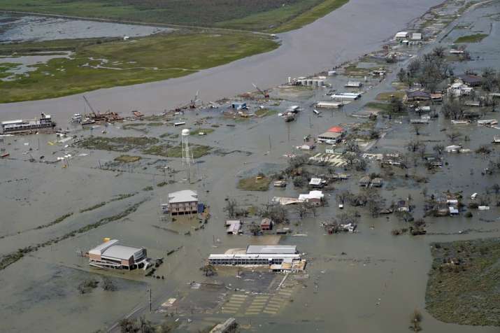 India Tv - Buildings and homes are flooded in the aftermath of Hurricane Laura Thursday, Aug. 27, 2020, in Cam