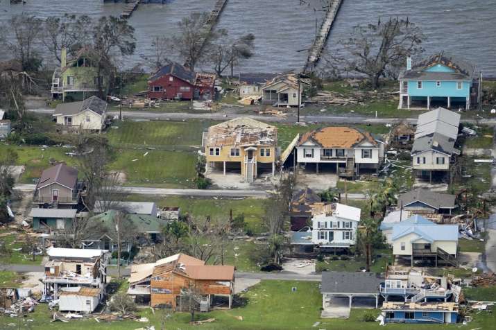 India Tv - Buildings and homes are damaged in the aftermath of Hurricane Laura Thursday, Aug. 27, 2020, near La