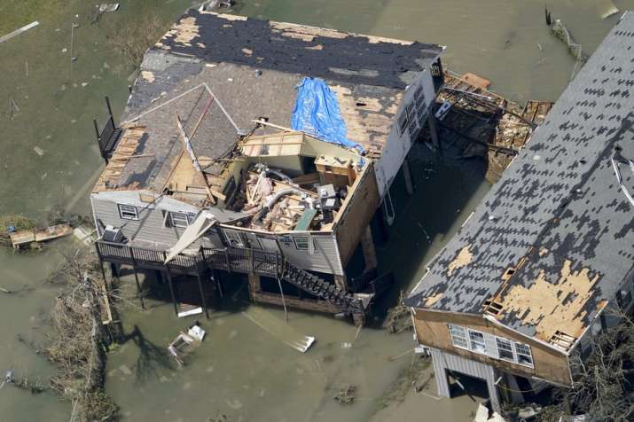 India Tv - Buildings are damaged in the aftermath of Hurricane Laura Thursday, Aug. 27, 2020, near Lake Charles