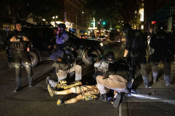 A man is treated after being shot Saturday, Aug. 29, 2020, in Portland