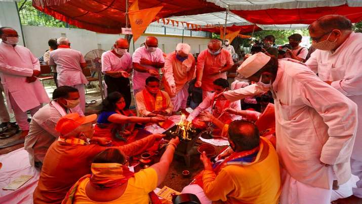 India Tv - Hindus offer prayers for a groundbreaking ceremony of a temple dedicated to the Hindu god Ram in Ayodhya, at the Vishwa Hindu Parishad, or World Hindu Council, headquarters in New Delhi. India Tv - Ram, Ram Janmabhoomi pujan, Ram Mandir bhoomi pujan, Ram Temple, Ayodhya, PM Modi