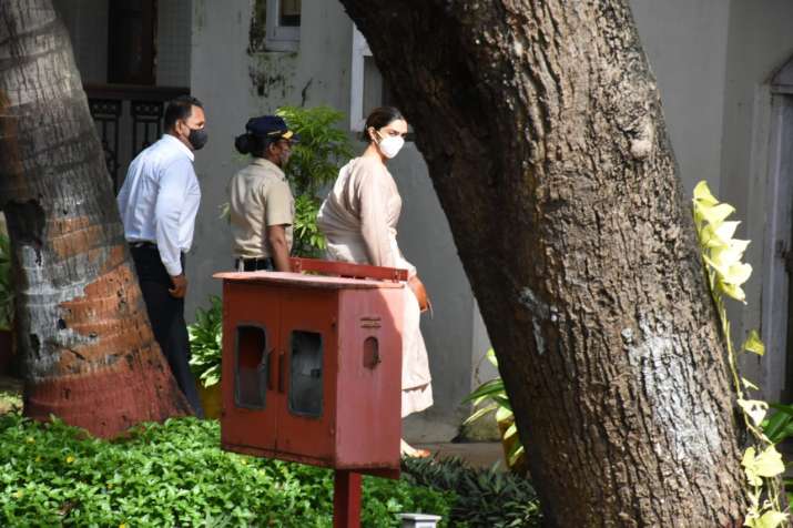 India Tv - The actress giving a glance at the reporters present there before she enters the NCB guest house