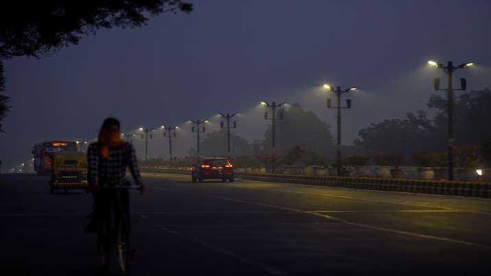 Vehicles ply on Safdarjung flyover, during cold morning,