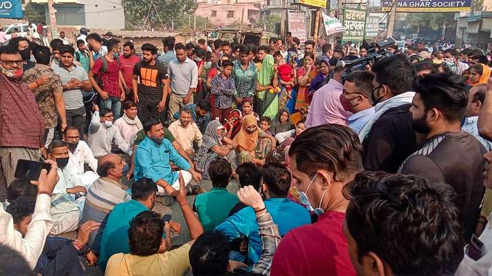 Family members of a girl who was shot dead by Taufeeq, the