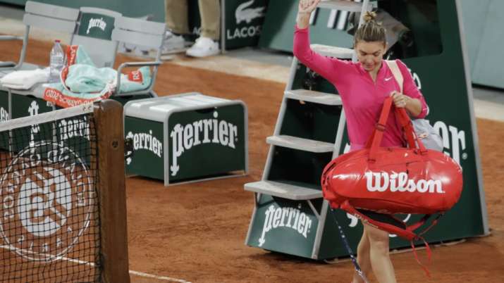 Romania's Simona Halep leaves after losing her fourth-round