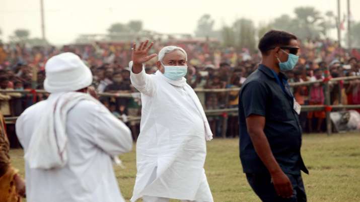 Bihar Chief Minister Nitish Kumar waves at the crowd during