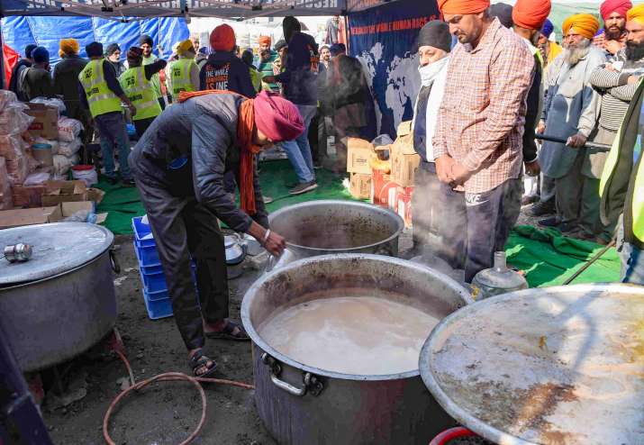 India Tv - New Delhi: Farmers prepare food at Singhu border during their ongoing protest march Delhi Chalo against Centres new farm laws, in New Delhi, Sunday, Nov. 29, 2020.  