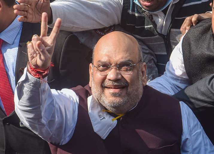 Kolkata: Union Home Minister Amit Shah flashes victory sign