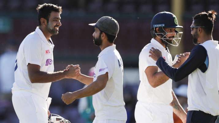 India's Ravichandran Ashwin, left, is congratulated by his