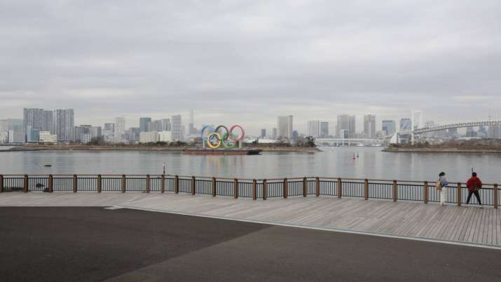 The Olympic rings are seen at the empty Odaiba waterfront