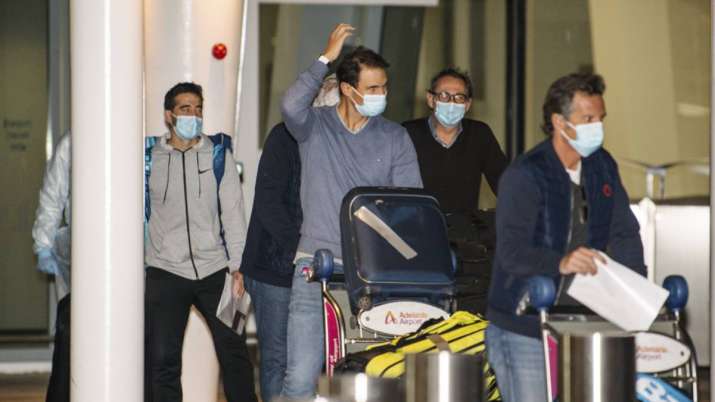 Spain's Rafael Nadal, center, arrives at Adelaide Airport