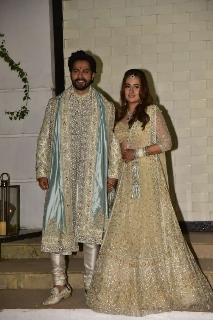 India Tv - Varun & Natasha post wedding greeted the paparazzi waiting outside the venue