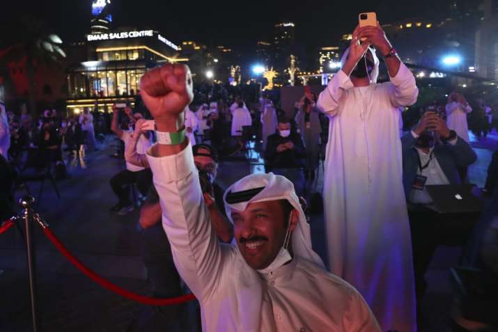 India Tv - Emiratis celebrate after the Hope Probe enters Mars orbit as a part of Emirates Mars mission, in Dubai, United Arab Emirates, Tuesday, Feb. 9, 2021. The spacecraft from the United Arab Emirates swung into orbit around Mars in a triumph for the Arab world’s first interplanetary mission. It is the first of three robotic explorers arriving at the red planet over the next week and a half.
