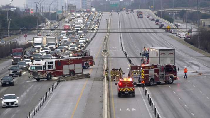 The highway sits closed as emergency crews finish cleaning