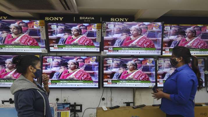 People watch Finance Minister Nirmala Sitharaman presenting