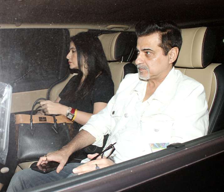 India Tv - Sanjay Kapoor with wife outside the Kapoor mansion on Sunday.