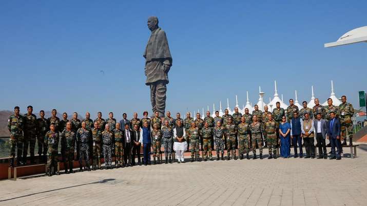 India Tv - Union Defence Minister Rajnath Singh, in a group photo with Tri-service Commanders, at the Combined Commanders’ Conference at Kevadia, Narmada district of Gujarat on Friday, March 05, 2021. Also seen are Chief of Defence Staff General Bipin Rawat, Chief of Army Staff General M M Naravane, Chief of Naval Staff Admiral Karambir Singh, Chief of Air Staff Air Chief Marshal R K S Bhadauria, Defence Secretary Dr Ajay Kumar, Secretary (Defence Production) Shri Raj Kumar and Secretary, Department of Defence R&D and Chairman Defence Research and Development Organisation (DRDO) Dr G Satheesh Reddy.