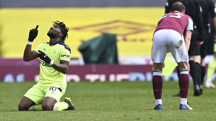 Newcastle's Allan Saint-Maximin, left, reacts following the