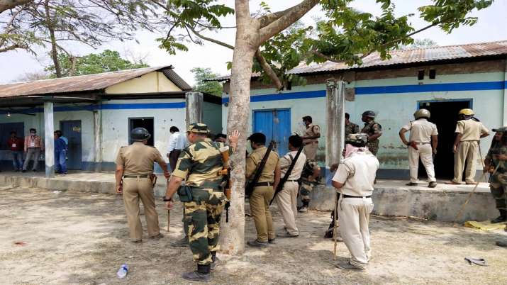 Security personnel keep vigil at a polling station after