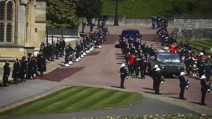 Members of the Royal family follow the coffin of Britain's