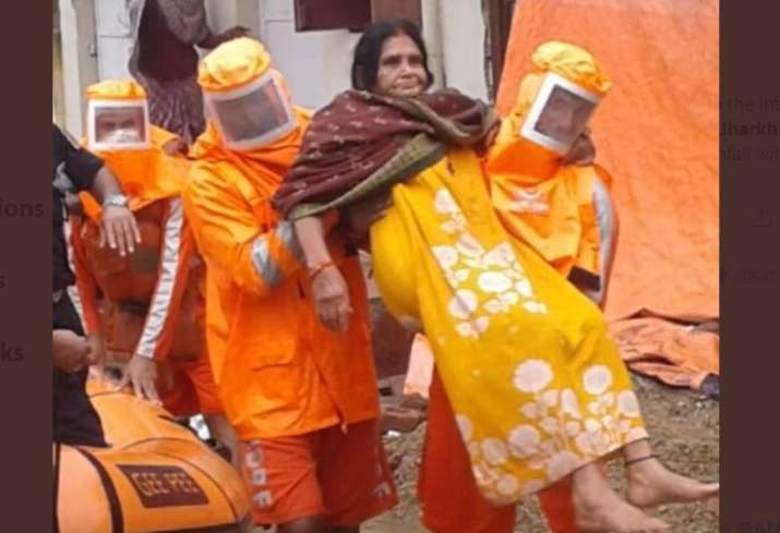 India Tv - NDRF team rescuing a woman in Jamshedpur