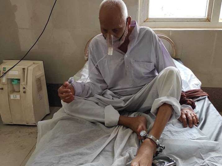 In picture, 90-year-old prisoner chained during treatment