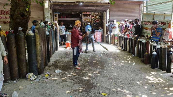 Family members of COVID-19 patients wait outside an
