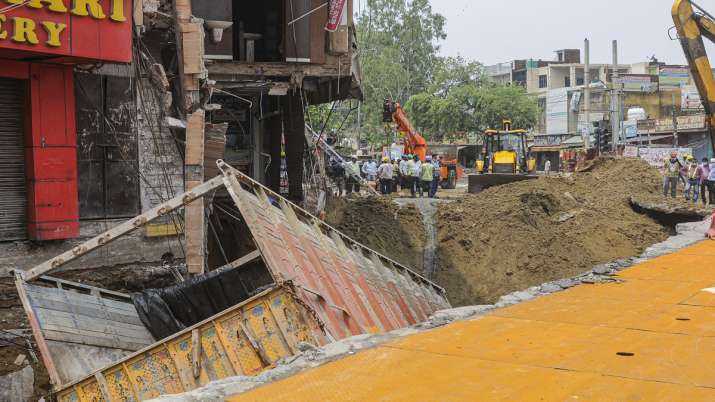 cyclone tauktae, Truck, fall, caved road, heavy rainfall, Delhi, aftermath, metro station, national