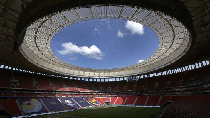 Employees prepare the National Stadium for the tomorrow's