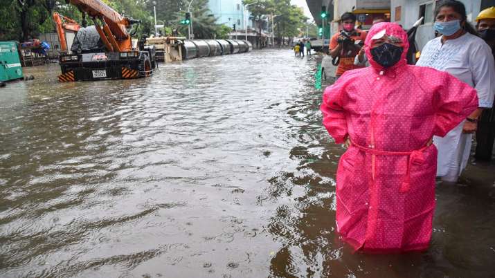 Mumbai Mayor Kishori Pednekar stands on a waterlogged road
